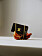 Liten svart handväska med guldig axelrem från Celine by Hedi Slimane.